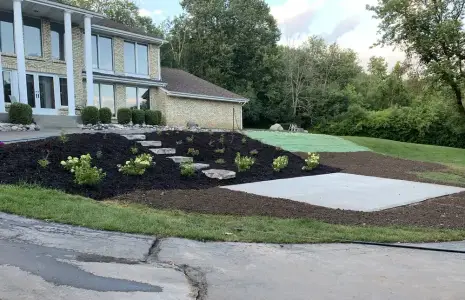 After: regraded hillside with healthy lawn established